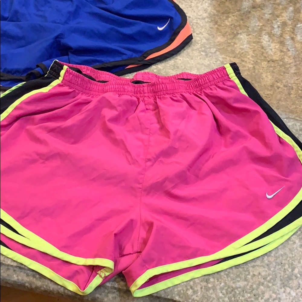 Pink and yellow Nike  shorts